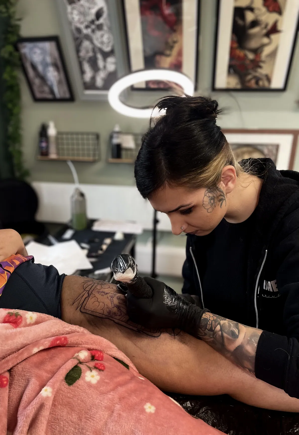 Eva tattooing in the studio